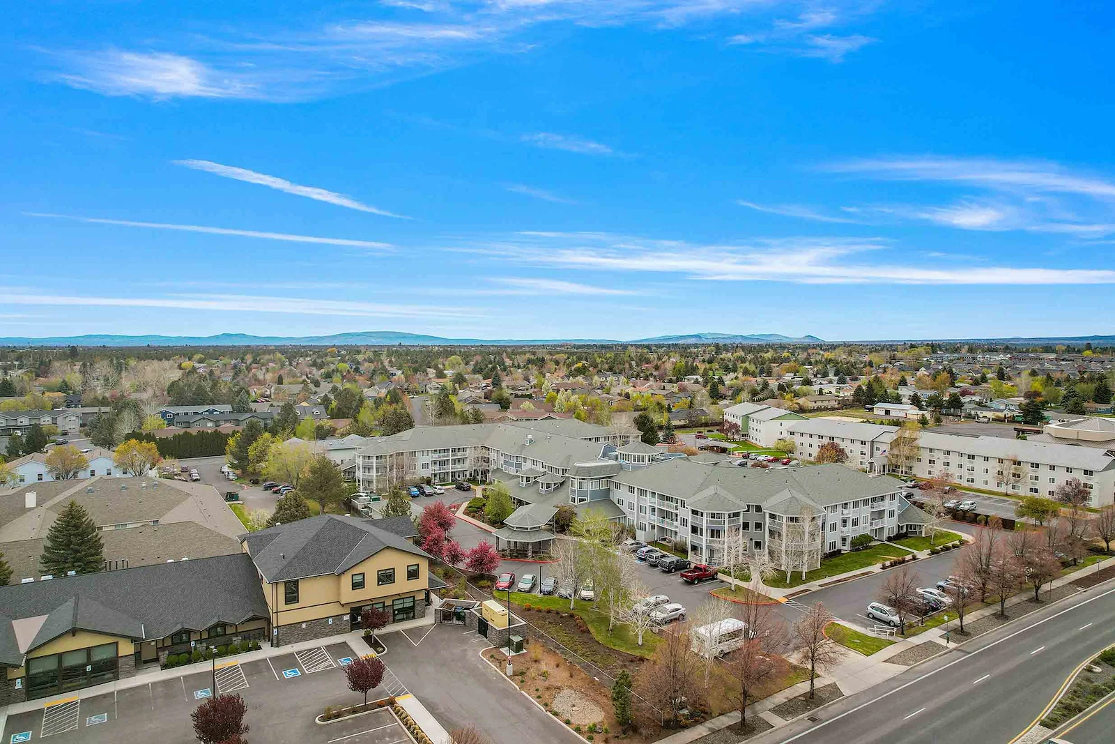 Stone Lodge Gracious Retirement Living Hawthorn Senior independent Living in Bend, Oregon front exterior drone view