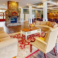 Orchard Ridge's indoor lounge area and fireplace