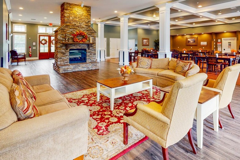 Orchard Ridge's indoor lounge area and fireplace