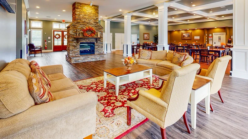 Orchard Ridge's indoor lounge area and fireplace