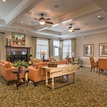 Barclay House of Aiken, senior living community offering assisted living and memory care in Aiken, SC, comfortable sitting area by fireplace