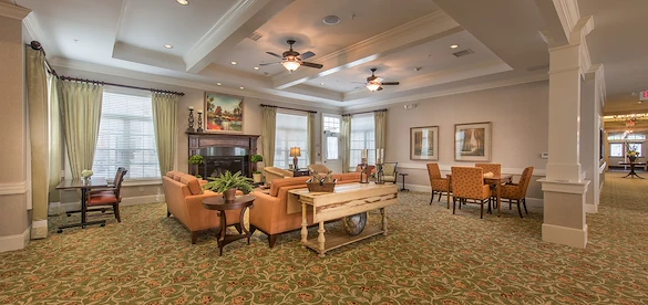 Barclay House of Aiken, senior living community offering assisted living and memory care in Aiken, SC, comfortable sitting area by fireplace