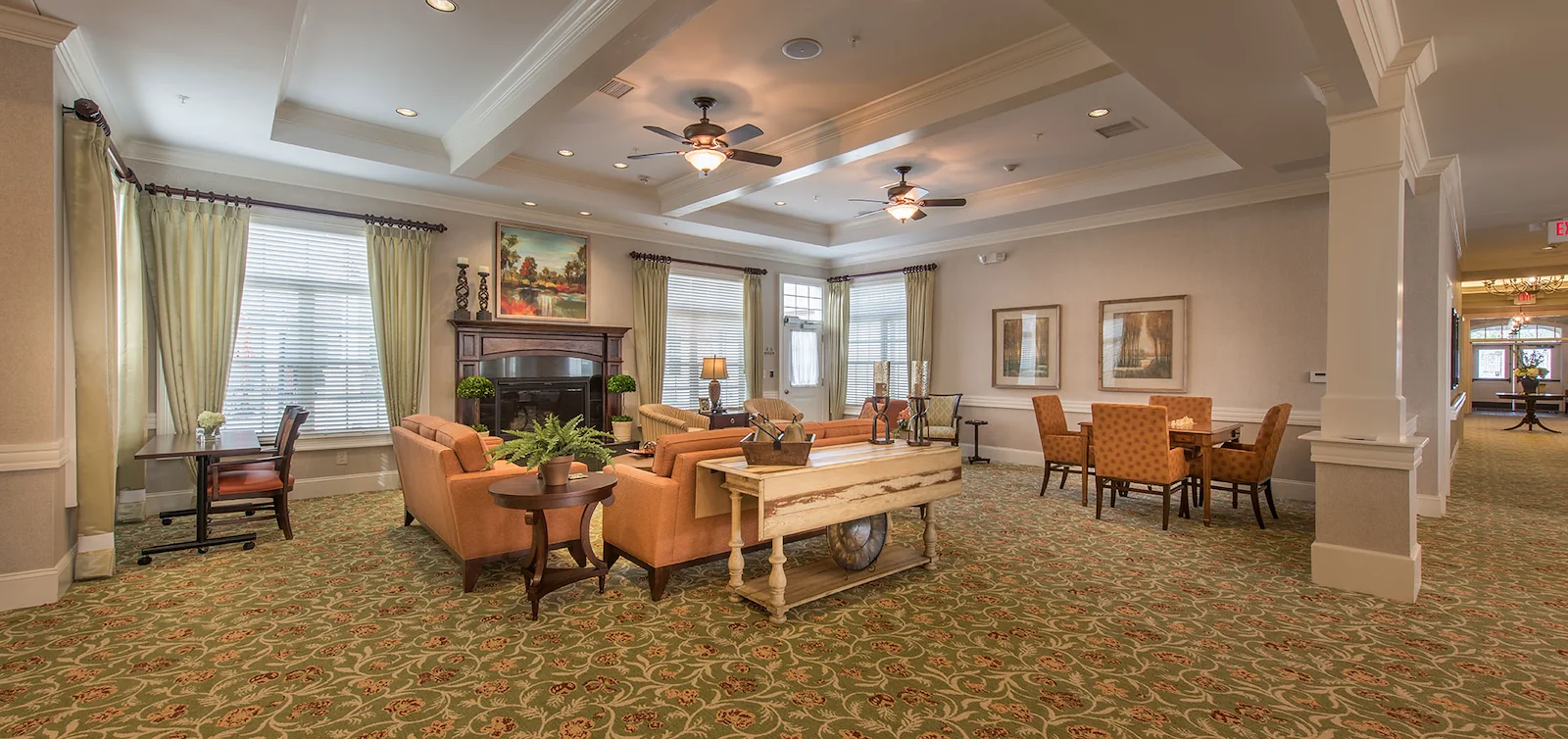 Barclay House of Aiken, senior living community offering assisted living and memory care in Aiken, SC, comfortable sitting area by fireplace