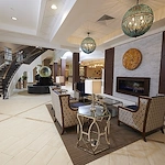 Allegro Richmond Heights senior living offering assisted living, memory care, and respite care in Richmond Heights, MO, lobby and seating by a fireplace