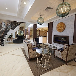 Allegro Richmond Heights senior living offering assisted living, memory care, and respite care in Richmond Heights, MO, lobby and seating by a fireplace