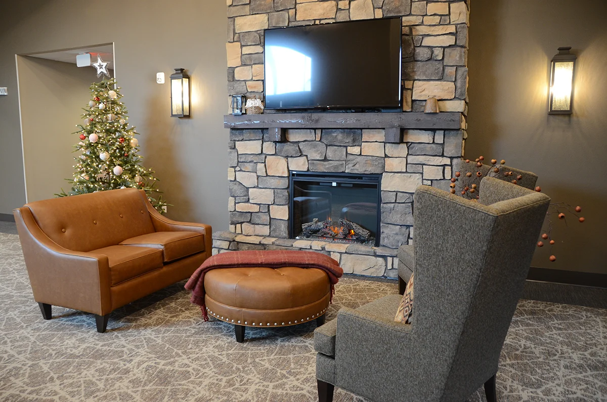 The Legacy of DeForest, WI, entry way and sitting area with fireplace