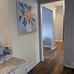 Legato Living Residential Memory Care at Eastridge senior living community offering assisted living, memory care, adult day services, and respite care in Omaha, NE, interior view looking down the hallway toward resident bedrooms