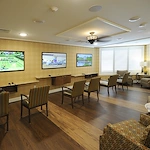 Allegro Winter Park senior living offering independent living, assisted living, memory care, and respite care in Winter Park, FL, activities room with multiple tvs