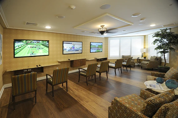 Allegro Winter Park senior living offering independent living, assisted living, memory care, and respite care in Winter Park, FL, activities room with multiple tvs