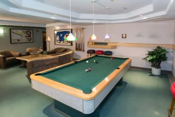 Las Fuentes Resort Village senior living in Prescott, AZ offering independent living, assisted living, and memory care, activities room featuring a pool table