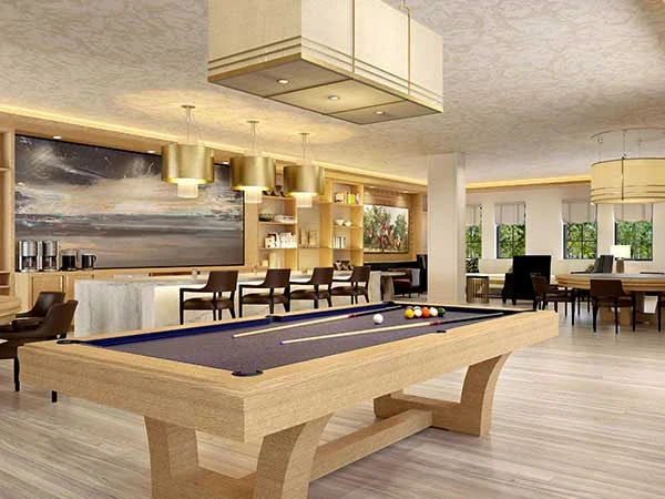 Wellington Bay with Lisbet Health Center senior living community offering independent living, assisted living, and memory care in Wellington, FL, common area featuring a bar and pool table