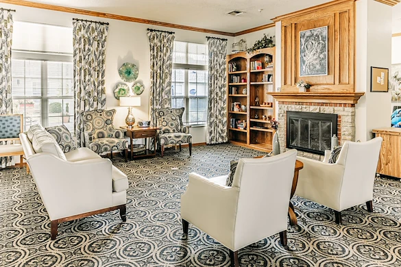 Alderbrook Village assisted living community in Arkansas City, KS, common sitting area by fireplace 