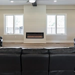 Legato Living Residential Memory Care at Five Fountains senior living community offering assisted living, memory care, adult day services, and respite care in Elkhorn, NE, community living room with comfortable seating near a fireplace