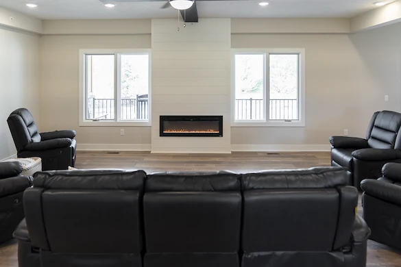 Legato Living Residential Memory Care at Five Fountains senior living community offering assisted living, memory care, adult day services, and respite care in Elkhorn, NE, community living room with comfortable seating near a fireplace