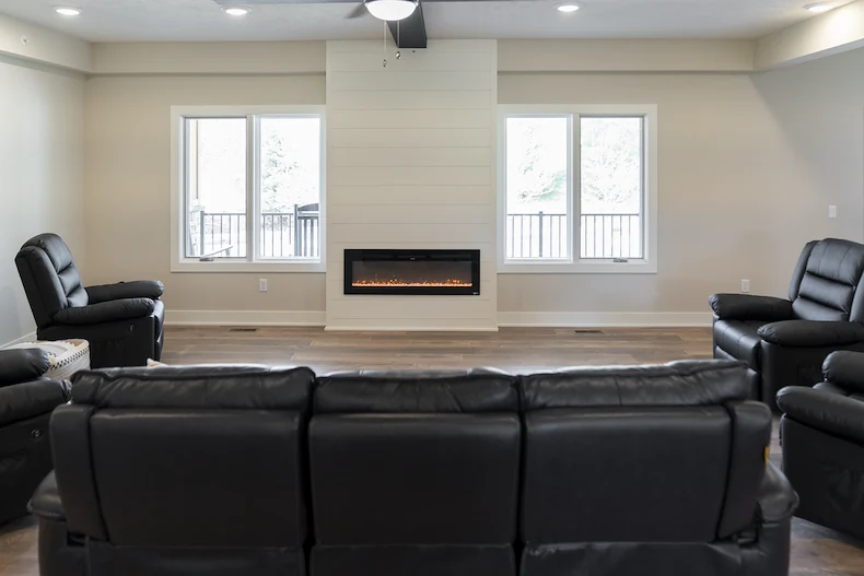 Legato Living Residential Memory Care at Five Fountains senior living community offering assisted living, memory care, adult day services, and respite care in Elkhorn, NE, community living room with comfortable seating near a fireplace