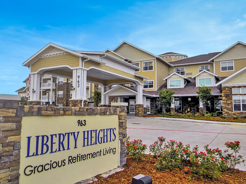 Liberty Heights Gracious Retirement Living Hawthorn Senior Independent Living in Rockwall, Texas front exterior entrance and welcome sign
