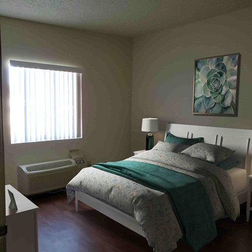 Bedroom in 1 bed/1 bath Assisted Living apartment (virtually staged photo, all apartments are unfurnished)