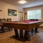 Heatherwood Senior Living activities room with pool table