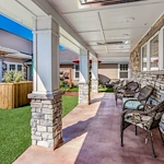 Chelsea Place Memory Care rear exterior patio seating area