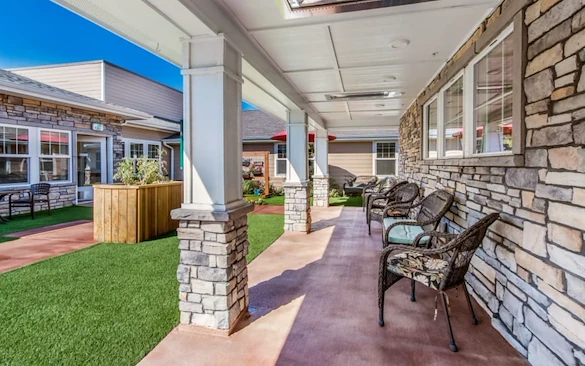 Chelsea Place Memory Care rear exterior patio seating area