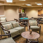 Avamere at Seaside senior living community offering independent living, assisted living, memory care, and respite care in Seaside, OR, lounge area with tables for games