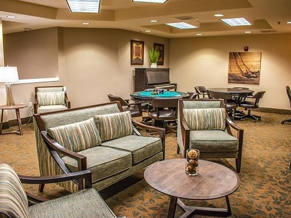 Avamere at Seaside senior living community offering independent living, assisted living, memory care, and respite care in Seaside, OR, lounge area with tables for games