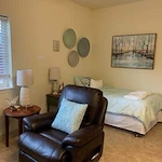 Avamere at South Hill senior living community offering assisted living and respite care in Spokane, WA, studio apartment with bed and sitting area