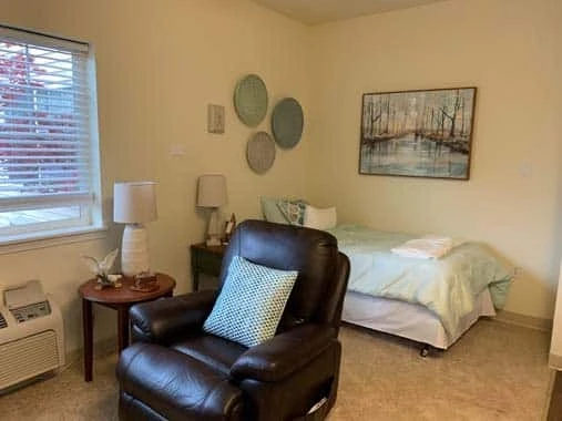 Avamere at South Hill senior living community offering assisted living and respite care in Spokane, WA, studio apartment with bed and sitting area