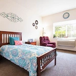 Albany Senior Living by Cogir, assisted living and respite care community in Albany, OR, cozy bedroom