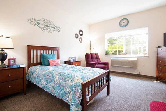 Albany Senior Living by Cogir, assisted living and respite care community in Albany, OR, cozy bedroom