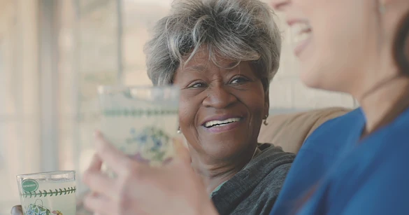 Assisting Hands Fremont, non-medical home care services in Newark, CA, serving Alameda County, smiling senior receiving companionship and care