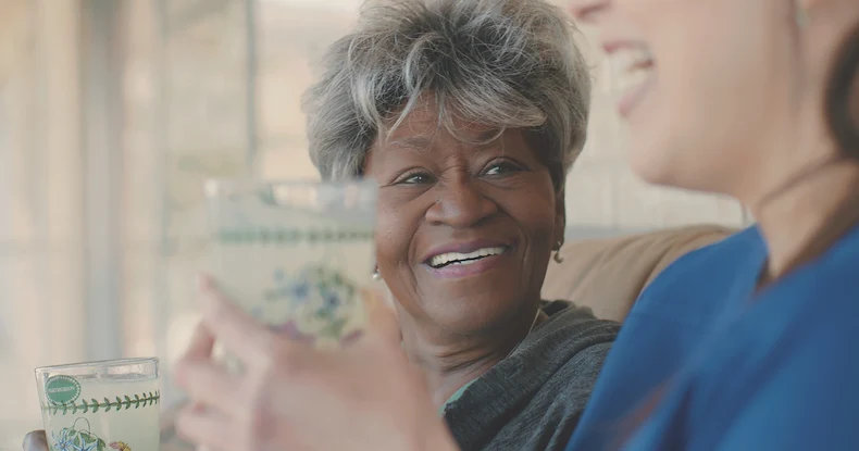 Assisting Hands Fremont, non-medical home care services in Newark, CA, serving Alameda County, smiling senior receiving companionship and care