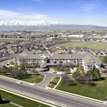 Pioneer Valley Lodge Gracious Retirement Living Hawthorn Senior Independent Living in North Logan, Utah front exterior drone view