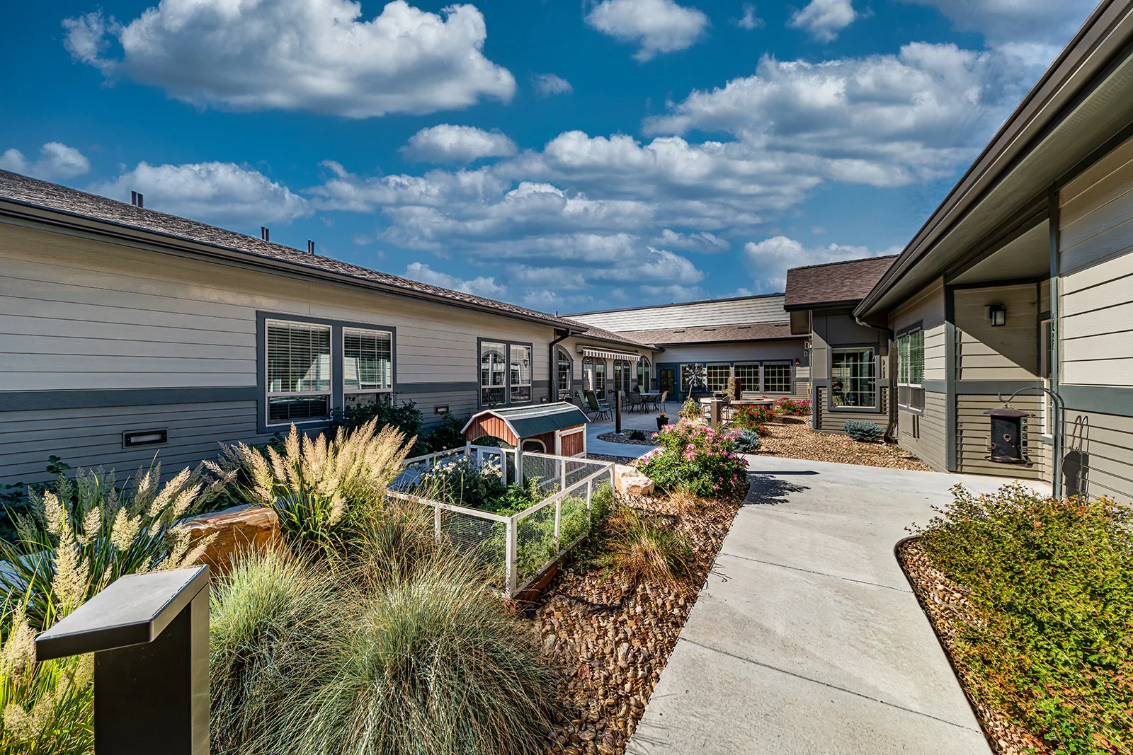 Aspens at Fort Collins Senior Living, senior living community offering assisted living, memory care, and respite care in Fort Collins, CO, outdoor area with walkinig path