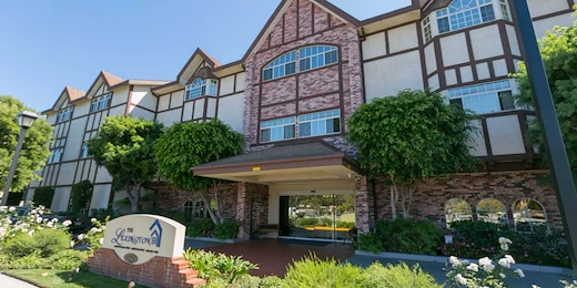 Lexington Assisted Living senior living community offering independent living, assisted living, and memory care in Ventura, CA, front exterior and entrance with large glass doors
