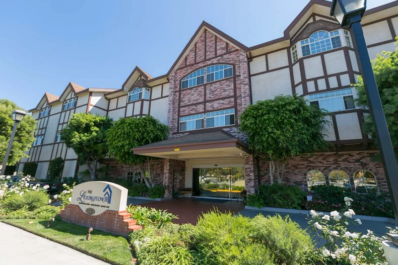 Lexington Assisted Living senior living community offering independent living, assisted living, and memory care in Ventura, CA, front exterior and entrance with large glass doors