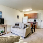 Salishan Gracious Retirement Living Hawthorn Senior Independent Living in Spring Hill, Florida apartment living room and kitchenette