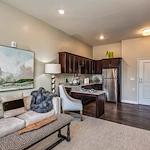 The Commons on Meridian Senior Living in Indianapolis, IN apartment living room and kitchen