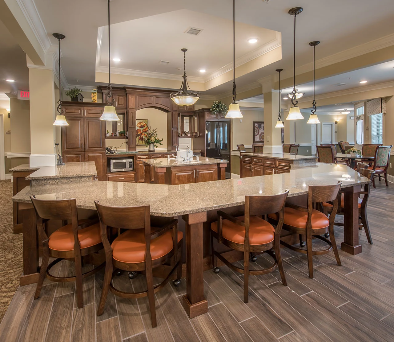 Barclay House of Aiken, senior living community offering assisted living and memory care in Aiken, SC, barstool seating at countertop in main community area