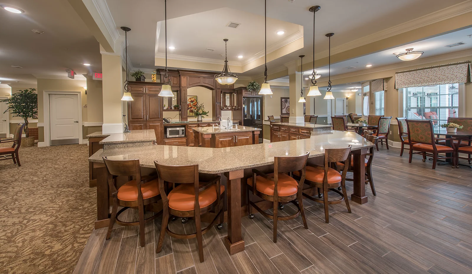 Barclay House of Aiken, senior living community offering assisted living and memory care in Aiken, SC, barstool seating at countertop in main community area