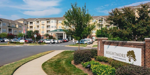 Brightmore of South Charlotte senior living community offering independent living, assisted living, and memory care in Charlotte, NC, community entrance featuring community sign