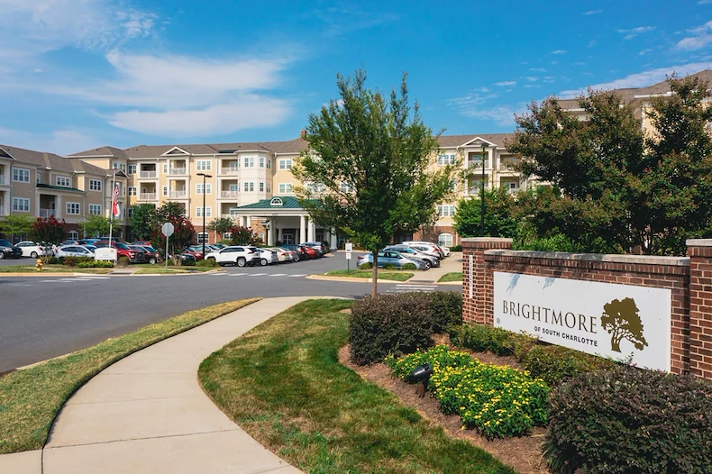 Brightmore of South Charlotte senior living community offering independent living, assisted living, and memory care in Charlotte, NC, community entrance featuring community sign