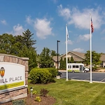 Churchill Place Senior Memory Care in Glen Ellyn, IL front entrance parking lot and welcome sign