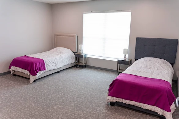 Legato Living Residential Memory Care at Heartland Hills senior living community offering assisted living, memory care, adult day services, and respite care in Bellevue, NE, shared suite with two beds and two nightstands