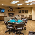 Avamere at Seaside senior living community offering independent living, assisted living, memory care, and respite care in Seaside, OR, lounging area with a game table