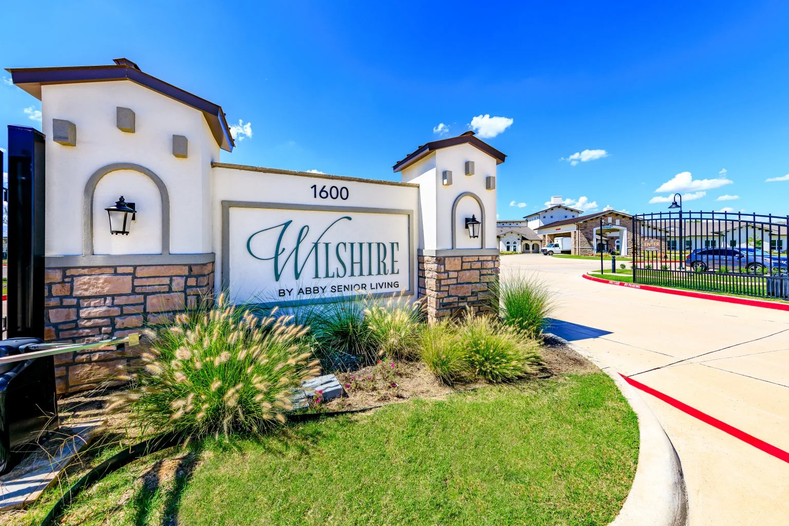 Wilshire Senior Living, independent living, assisted living, and memory care in Burleson, TX, sign at community entrance