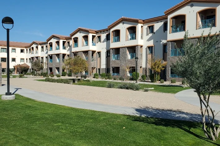 Walking paths throughout the community. Views of apartment homes from courtyard