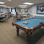 Allegro Tallahassee senior living offering independent living, assisted living, and respite care in Tallahassee, FL, activities room featuring a pool table and tables for games