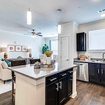 Kitchen and living area of a Vincent Senior Living Community apartment