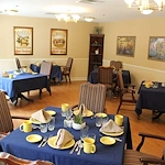 Well-lit dining room at Charter Senior Living of Jackson in Jackson, TN, with neatly set tables, designed for comfort and social dining in assisted living and memory care.